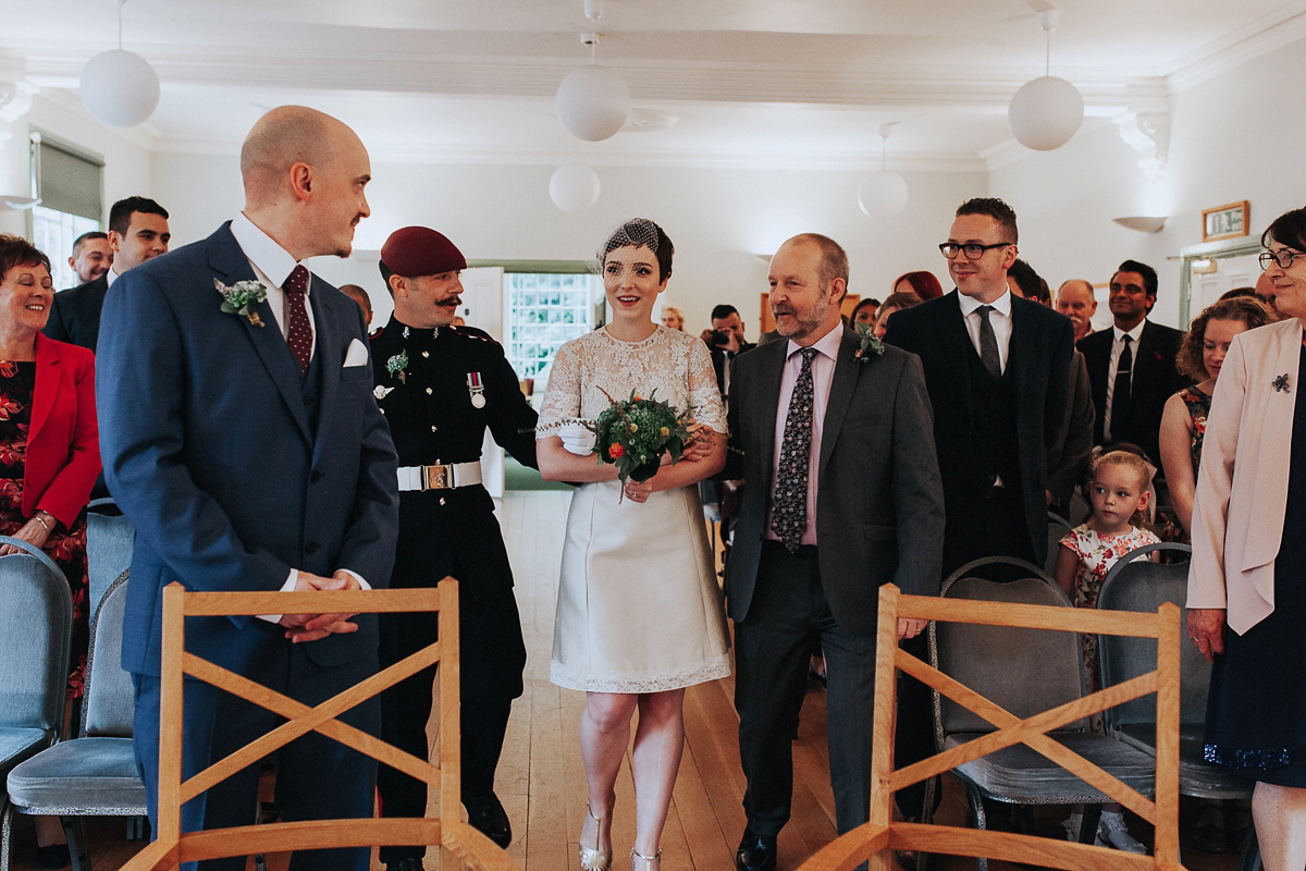 A short wedding dress and birdcage veil for a 1960's inspired bride. Image by Indie Photography.