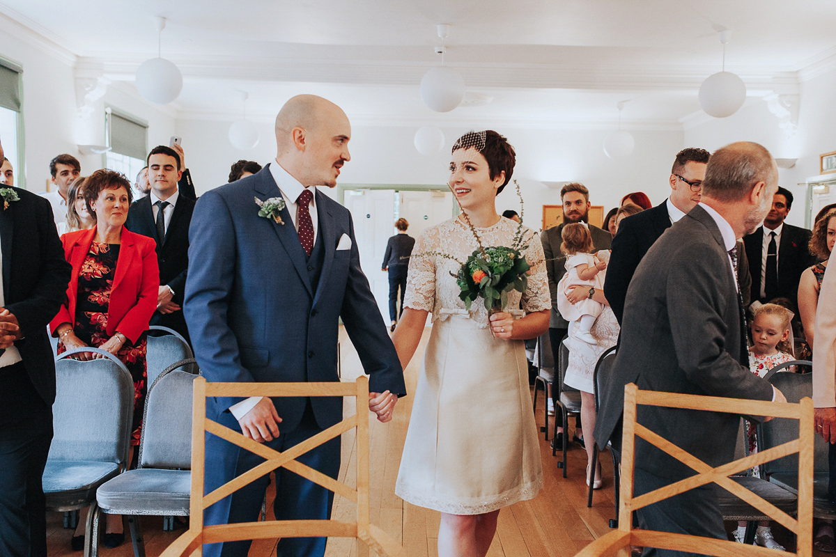 A short wedding dress and birdcage veil for a 1960's inspired bride. Image by Indie Photography.