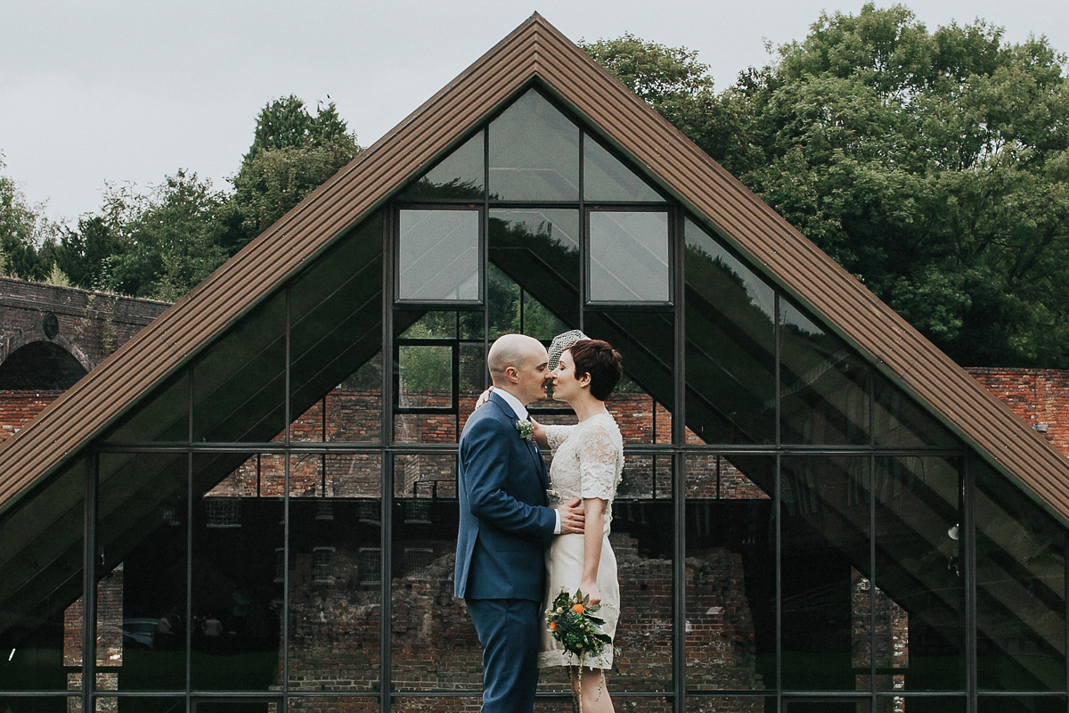 A short wedding dress and birdcage veil for a 1960's inspired bride. Image by Indie Photography.