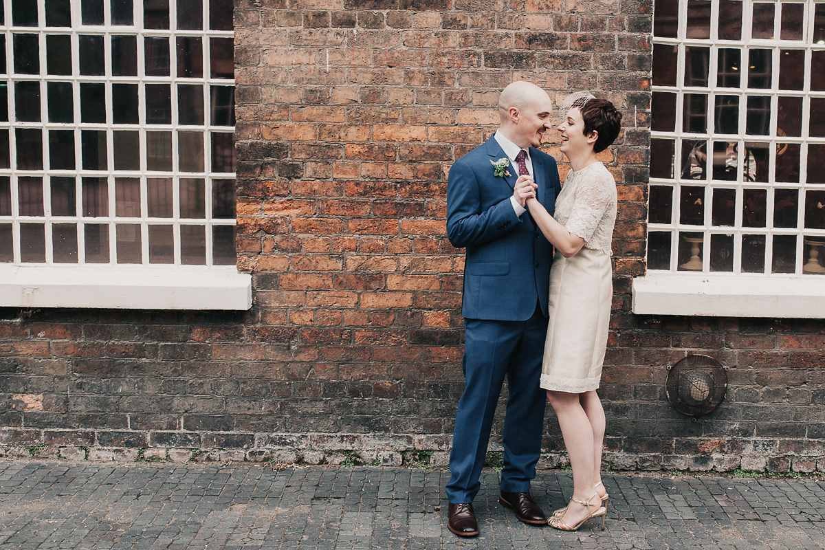 A short wedding dress and birdcage veil for a 1960's inspired bride. Image by Indie Photography.