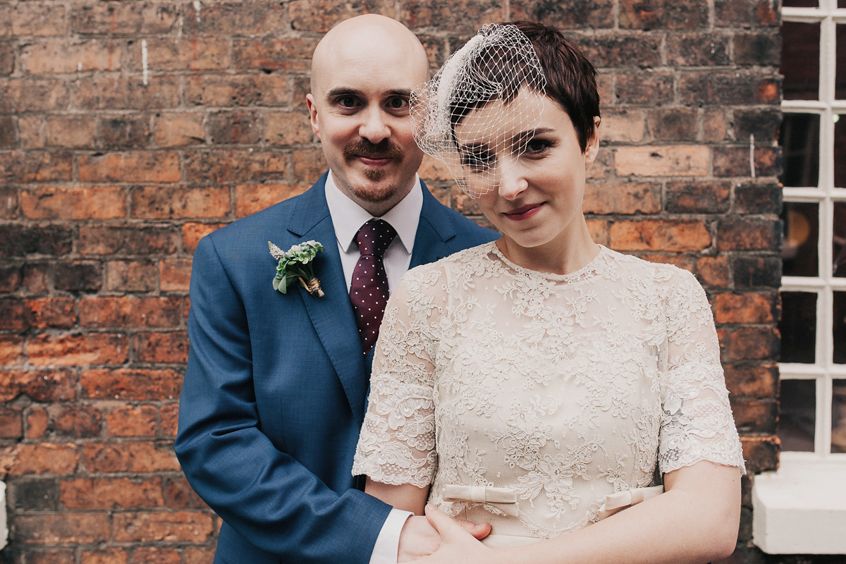 A short wedding dress and birdcage veil for a 1960's inspired bride. Image by Indie Photography.