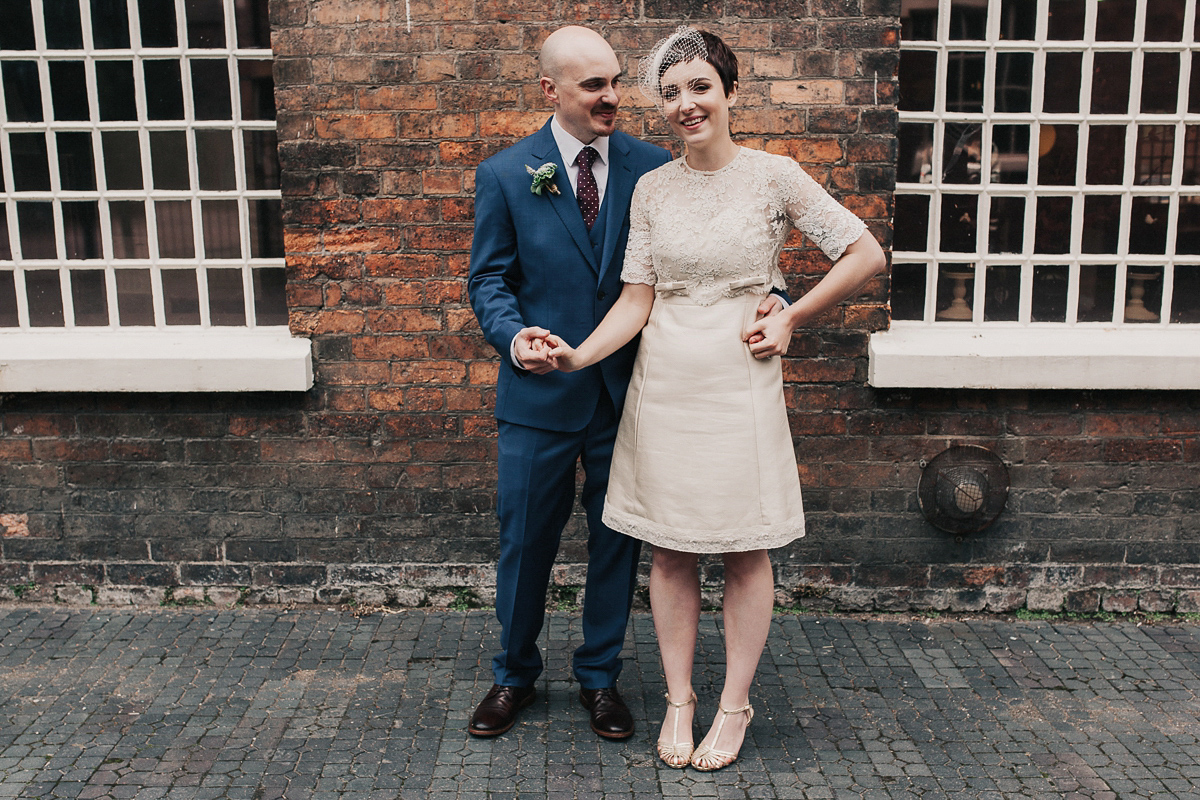 A short wedding dress and birdcage veil for a 1960's inspired bride. Image by Indie Photography.