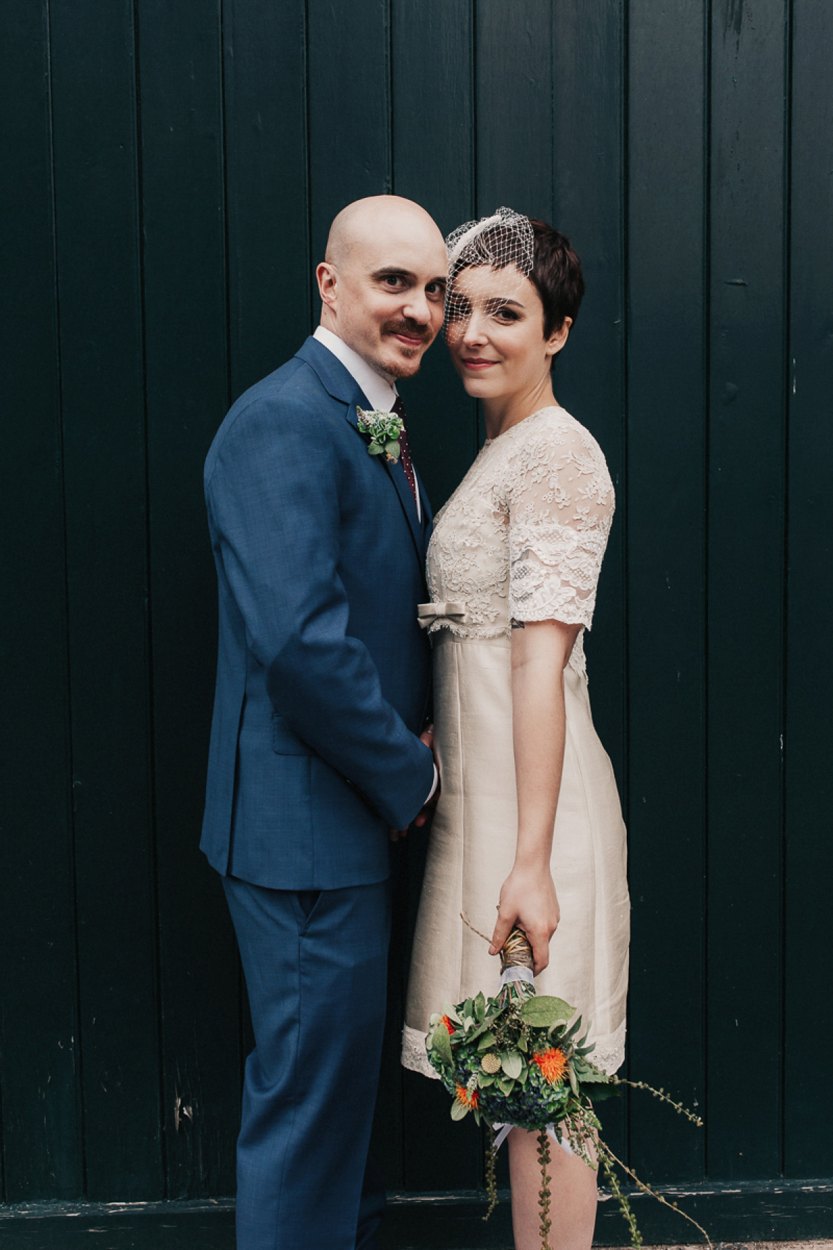 A short wedding dress and birdcage veil for a 1960's inspired bride. Image by Indie Photography.