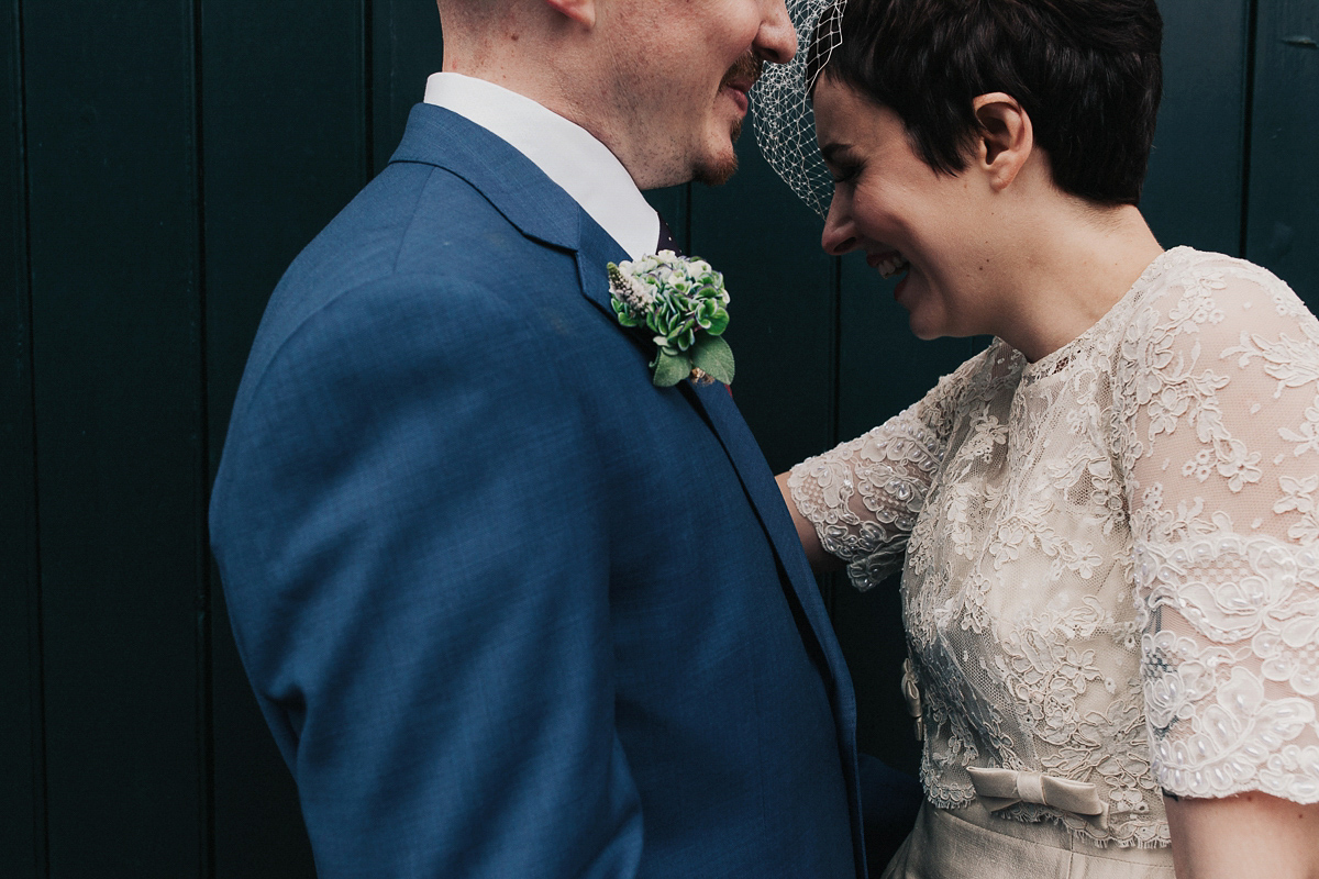 A short wedding dress and birdcage veil for a 1960's inspired bride. Image by Indie Photography.