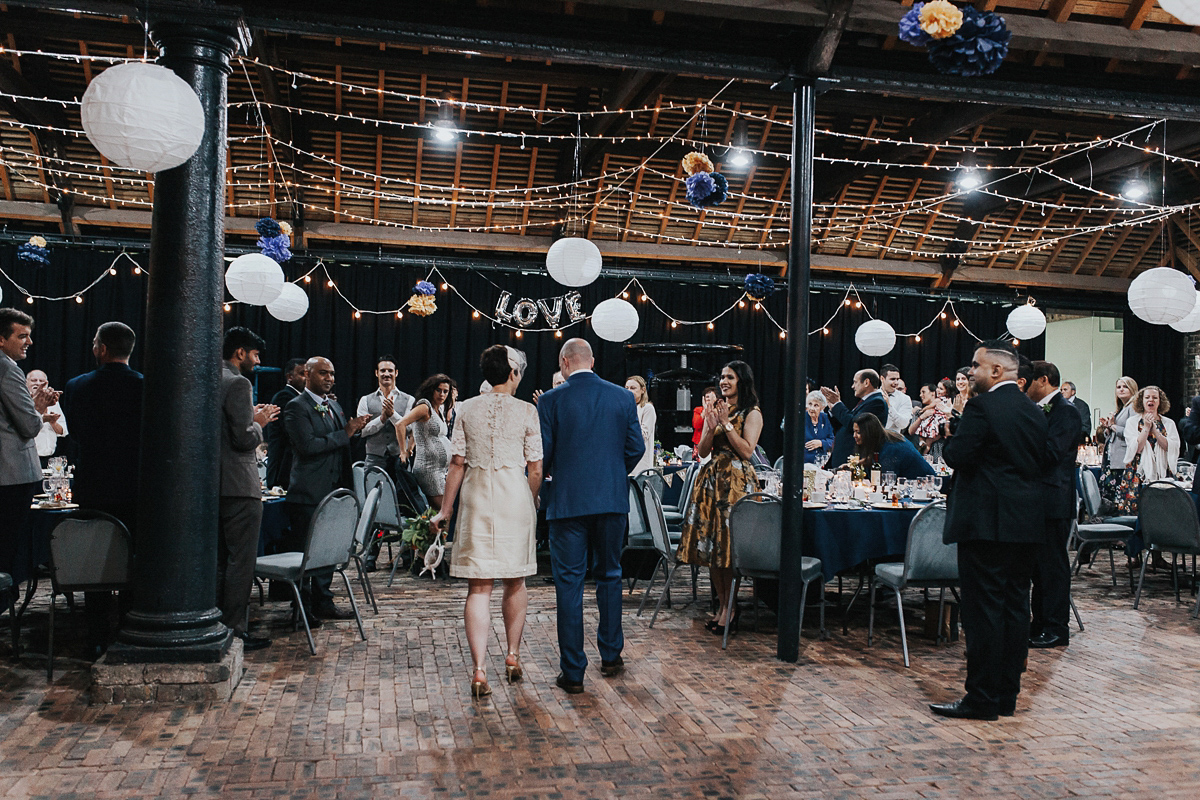 A short wedding dress and birdcage veil for a 1960's inspired bride. Image by Indie Photography.