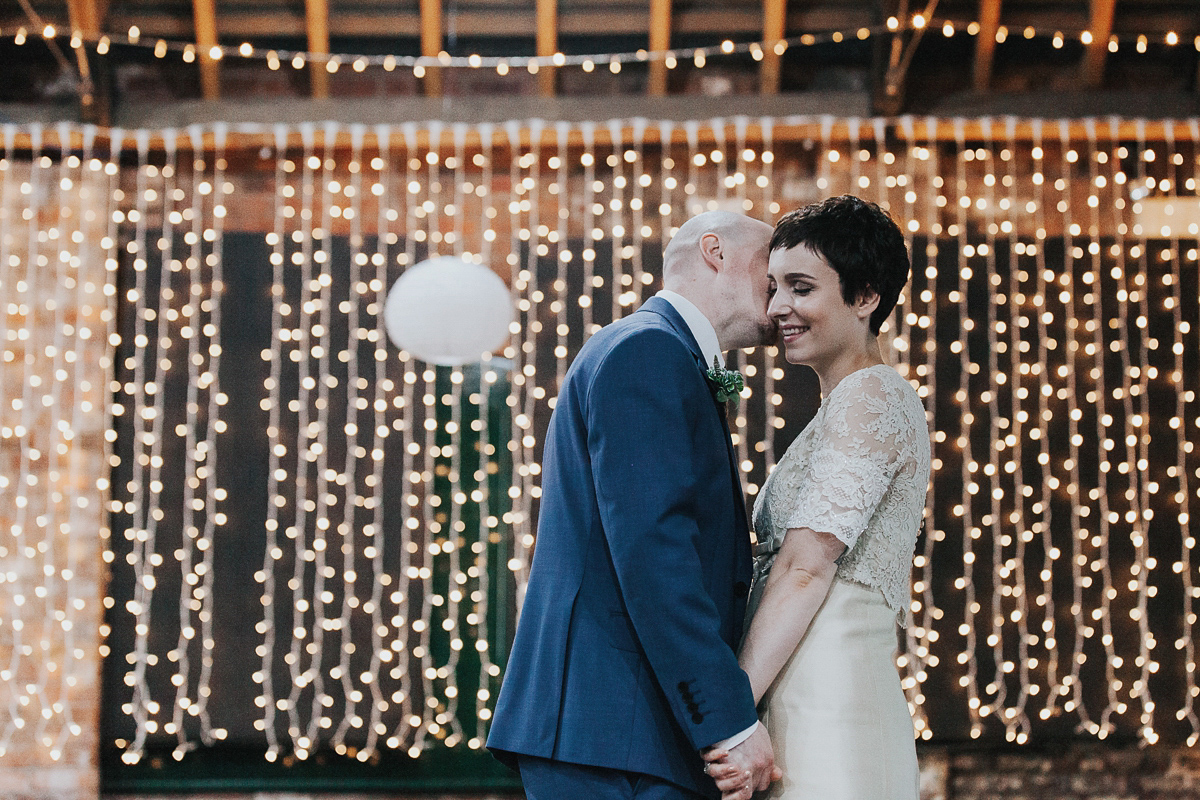 A short wedding dress and birdcage veil for a 1960's inspired bride. Image by Indie Photography.