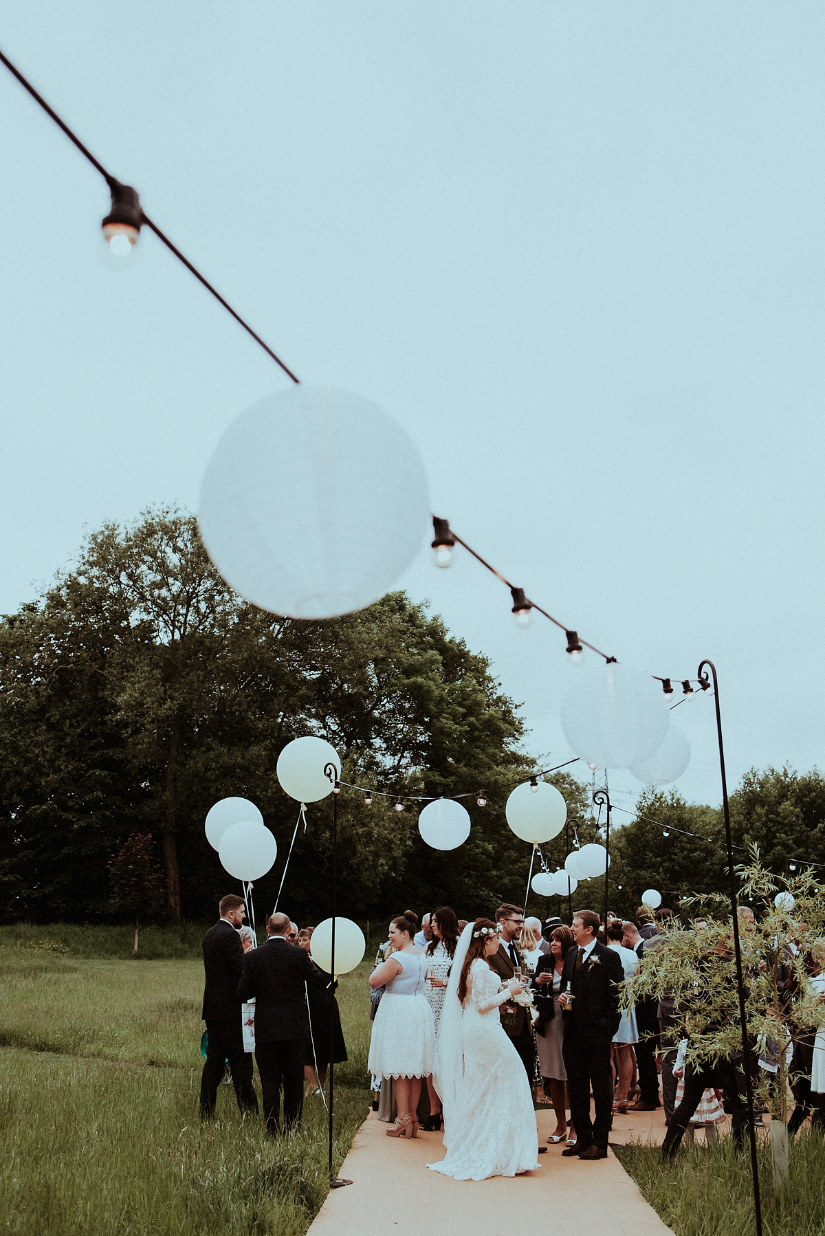 Alice wore an Essense of Australia gown for her rustic teepee wedding in North Yorkshire. Scandi teepees provided by Papakata, photography by Shutter Go Click.