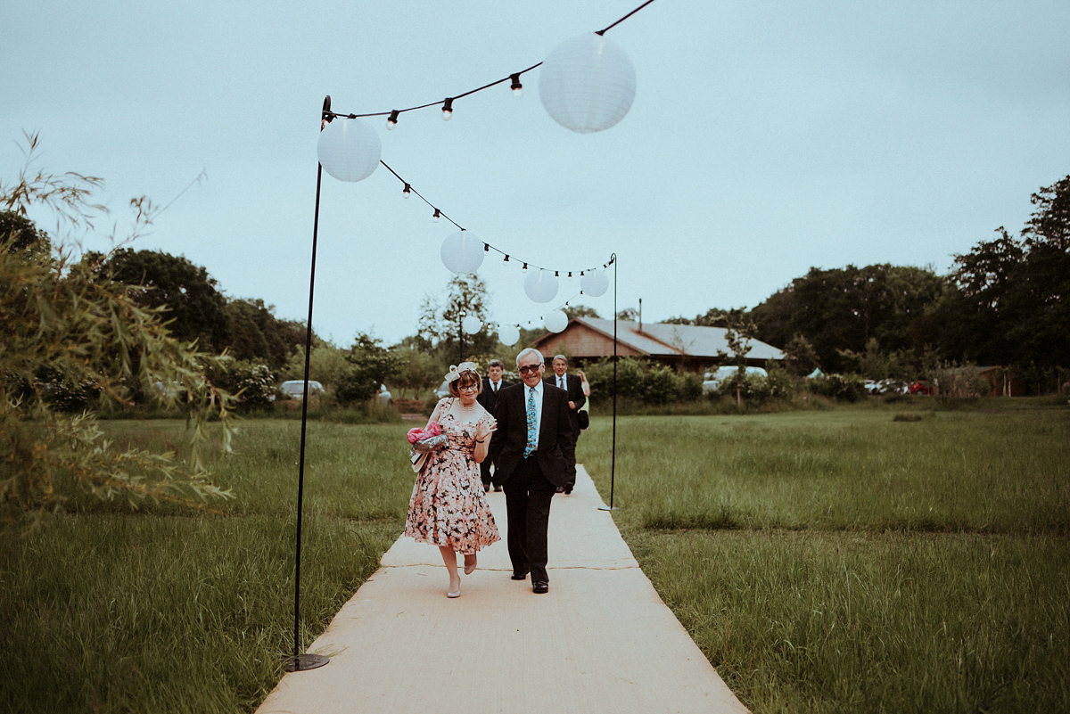 Alice wore an Essense of Australia gown for her rustic teepee wedding in North Yorkshire. Scandi teepees provided by Papakata, photography by Shutter Go Click.