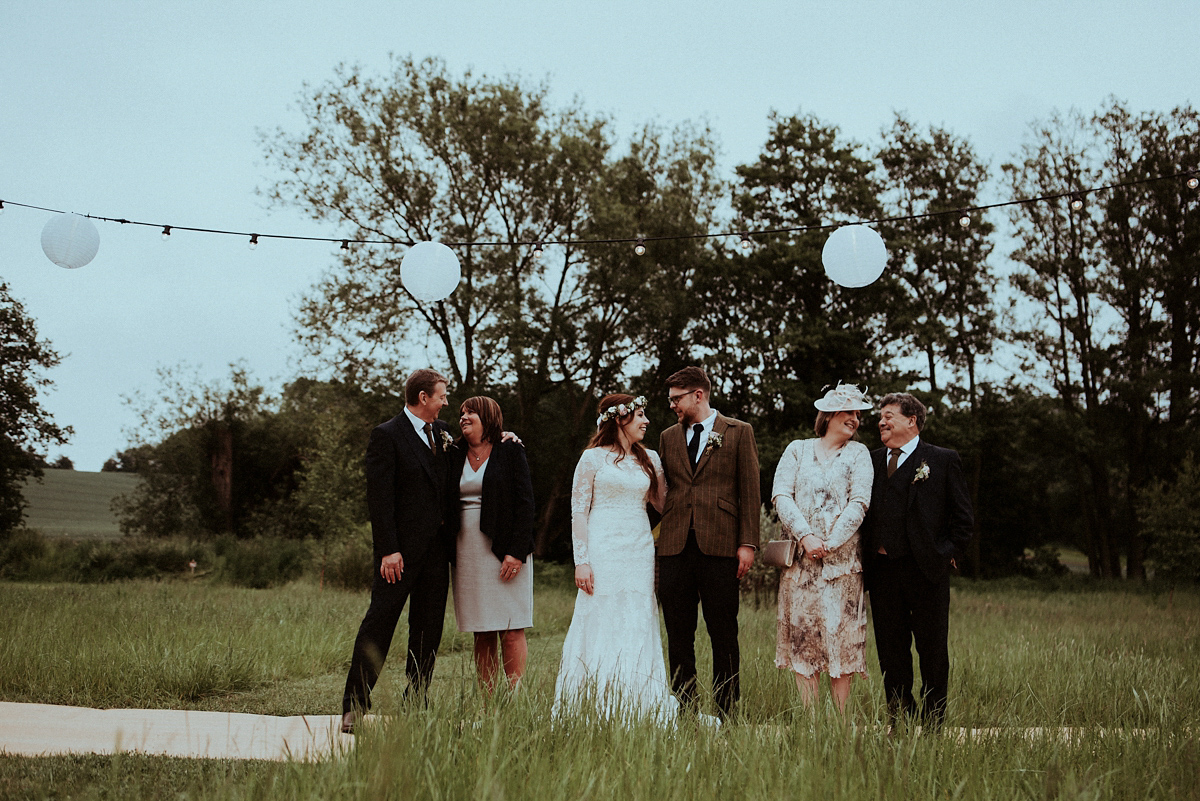 Alice wore an Essense of Australia gown for her rustic teepee wedding in North Yorkshire. Scandi teepees provided by Papakata, photography by Shutter Go Click.