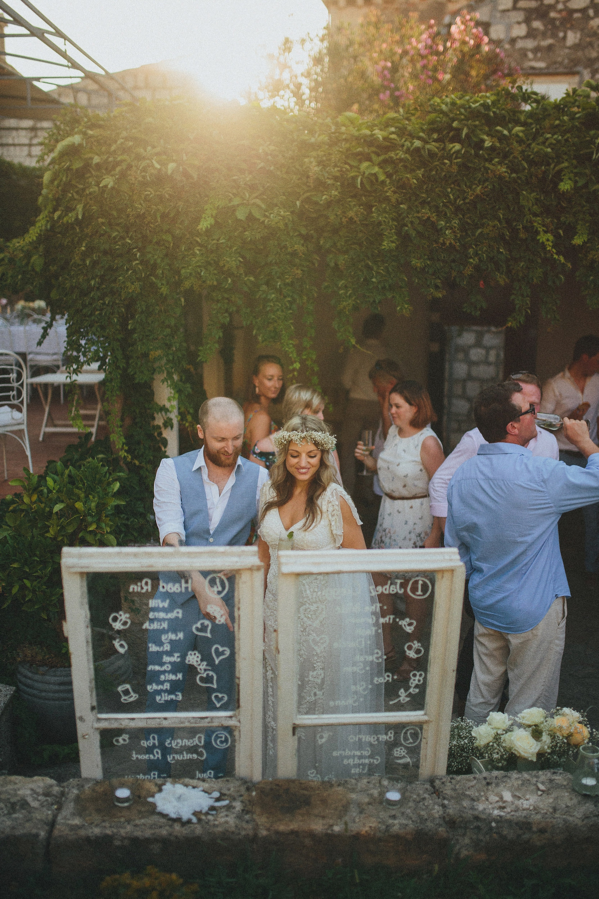 Bride Tamar wears an embellished Eliza Jane Howell gown and crown of gypsophila for her Croatian Island wedding. Photography by Petar Jurica.