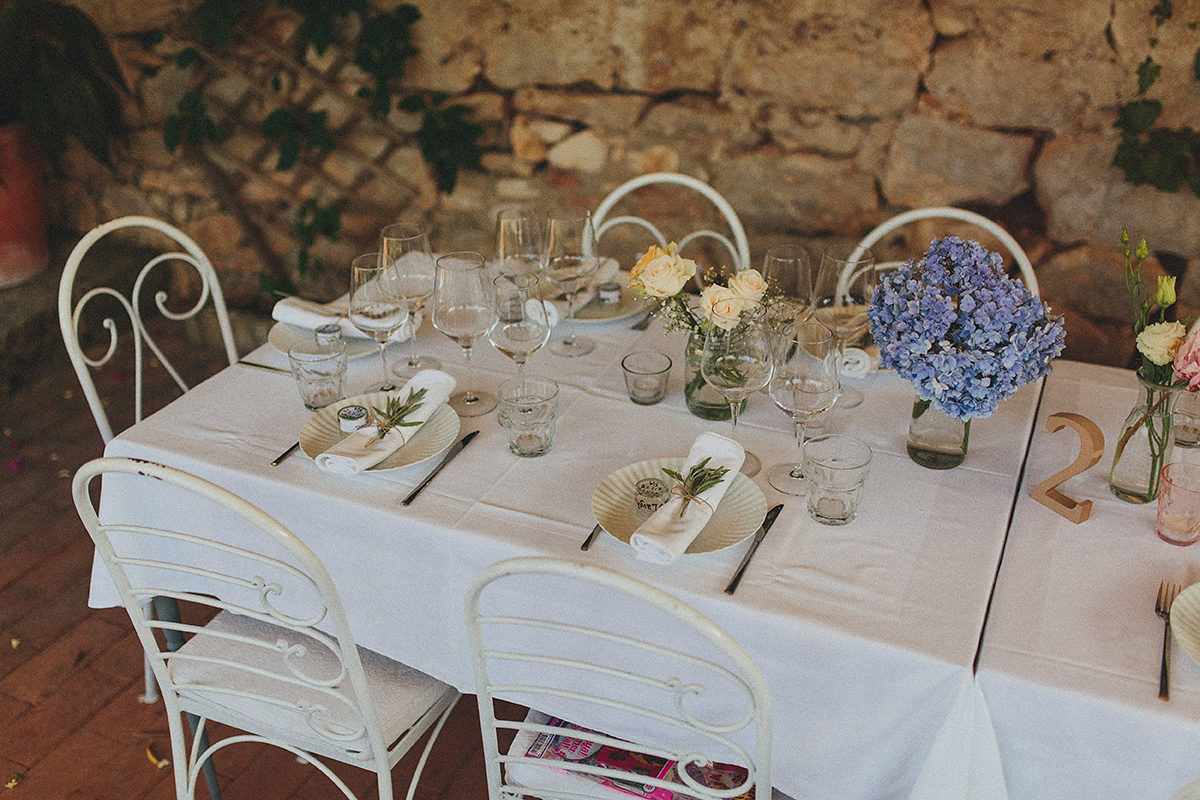 Bride Tamar wears an embellished Eliza Jane Howell gown and crown of gypsophila for her Croatian Island wedding. Photography by Petar Jurica.