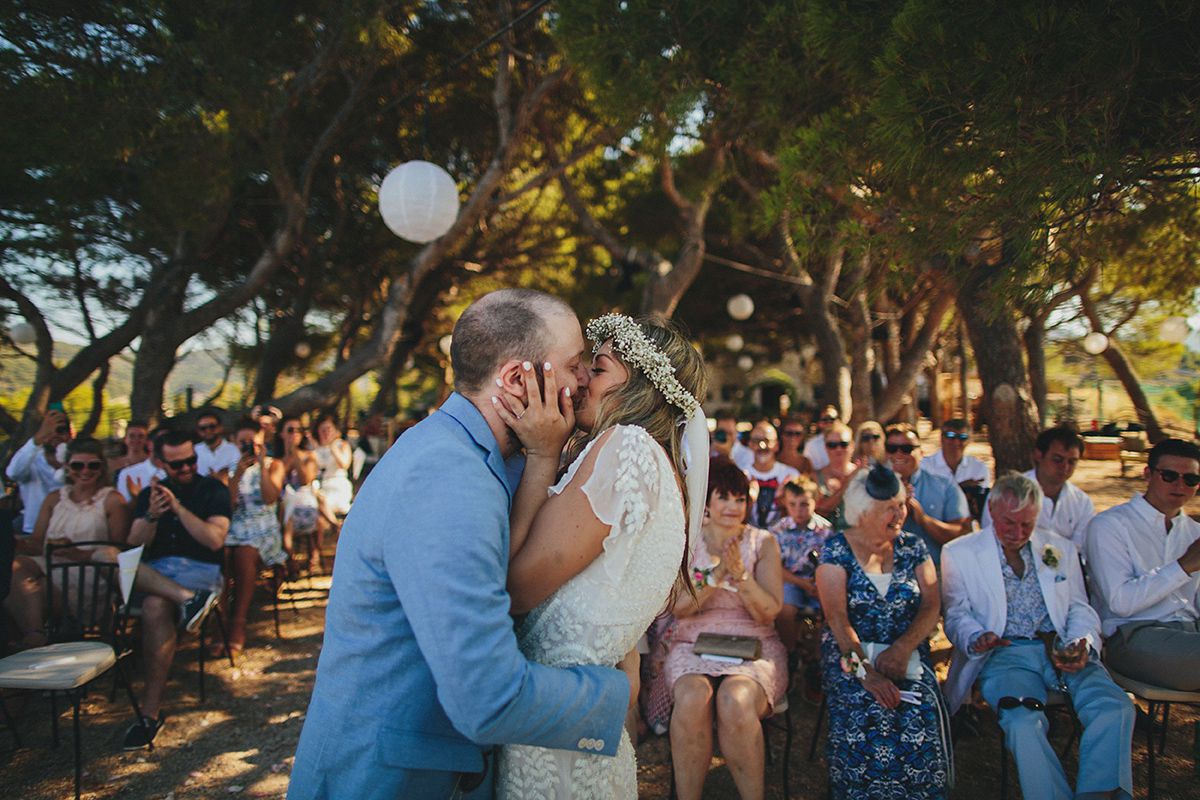 Bride Tamar wears an embellished Eliza Jane Howell gown and crown of gypsophila for her Croatian Island wedding. Photography by Petar Jurica.