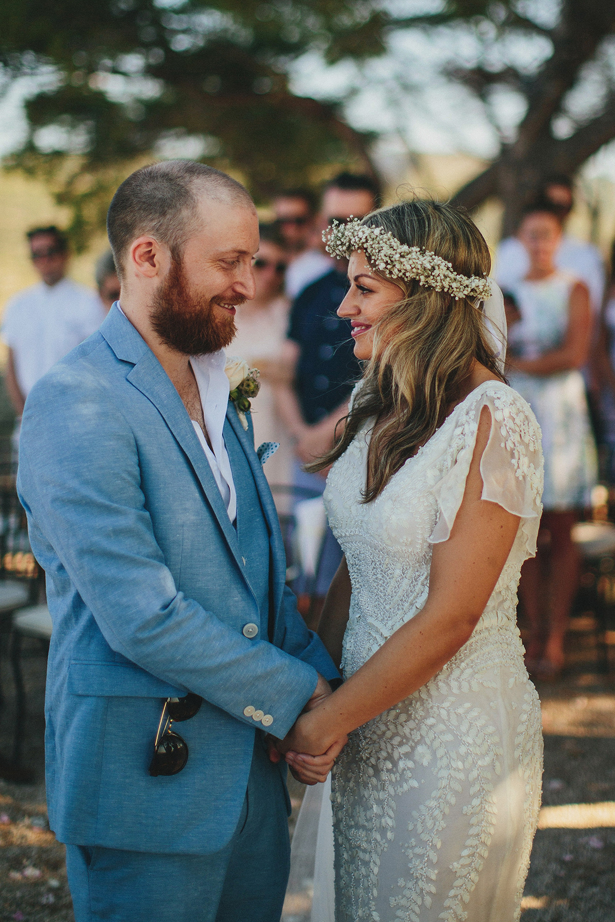 Bride Tamar wears an embellished Eliza Jane Howell gown and crown of gypsophila for her Croatian Island wedding. Photography by Petar Jurica.