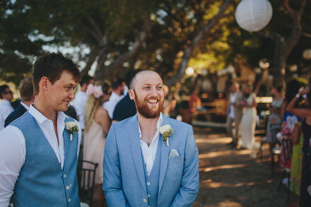 Bride Tamar wears an embellished Eliza Jane Howell gown and crown of gypsophila for her Croatian Island wedding. Photography by Petar Jurica.