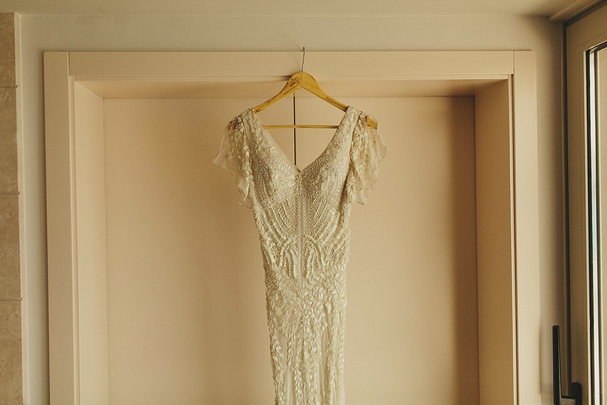 Bride Tamar wears an embellished Eliza Jane Howell gown and crown of gypsophila for her Croatian Island wedding. Photography by Petar Jurica.