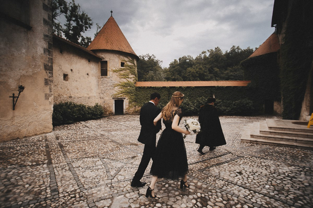 Tjaša wore a black lace and tulle gown by Alexandre Grecco for her nature inspired, minimalist castle wedding in Slovenia. Photography by That Happy Day.