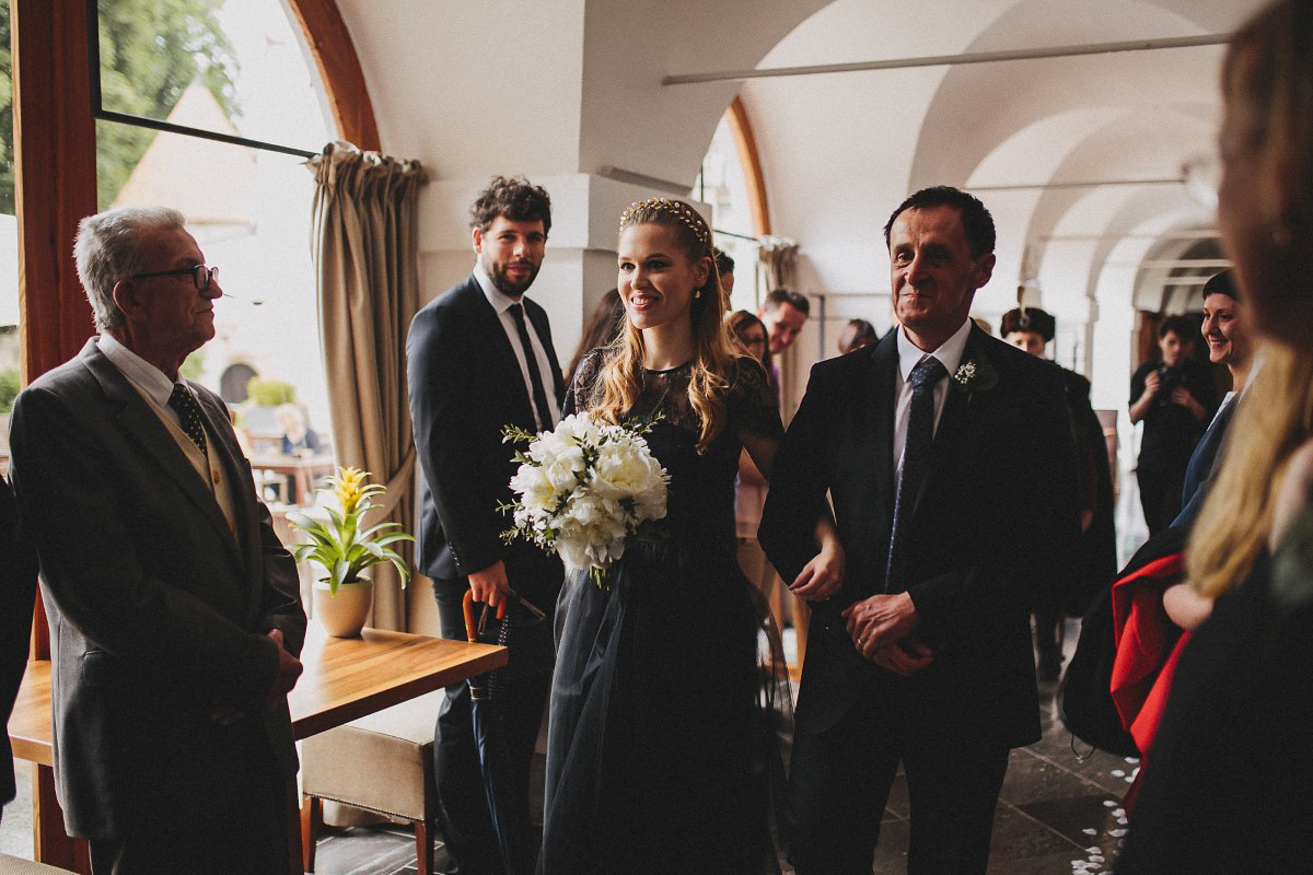 Tjaša wore a black lace and tulle gown by Alexandre Grecco for her nature inspired, minimalist castle wedding in Slovenia. Photography by That Happy Day.