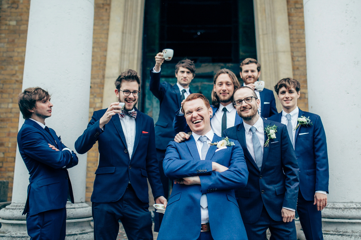 Bride Dany wears a 1950's inspired lace dress and birdcage veil for her modern cool wedding at The Asylum. Their reception was held in a London pub. Photography by Naomi Jane.