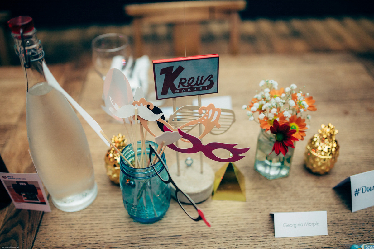 Bride Dany wears a 1950's inspired lace dress and birdcage veil for her modern cool wedding at The Asylum. Their reception was held in a London pub. Photography by Naomi Jane.