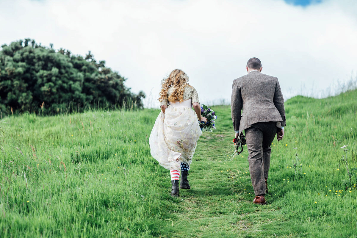 Bride Tatiana wore the Ireland gown by BHLDN for her Scottish elopement. Photography by Carley Buick.