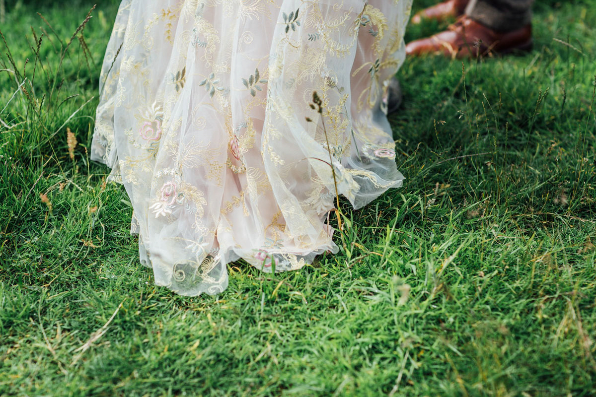 Bride Tatiana wore the Ireland gown by BHLDN for her Scottish elopement. Photography by Carley Buick.