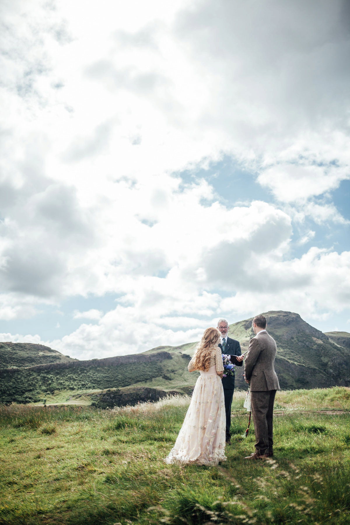 Bride Tatiana wore the Ireland gown by BHLDN for her Scottish elopement. Photography by Carley Buick.