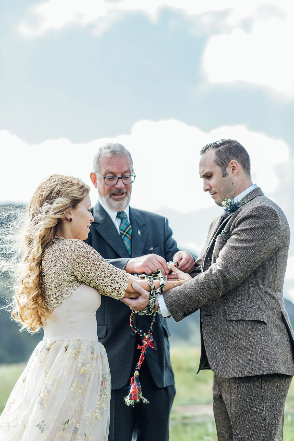 Bride Tatiana wore the Ireland gown by BHLDN for her Scottish elopement. Photography by Carley Buick.