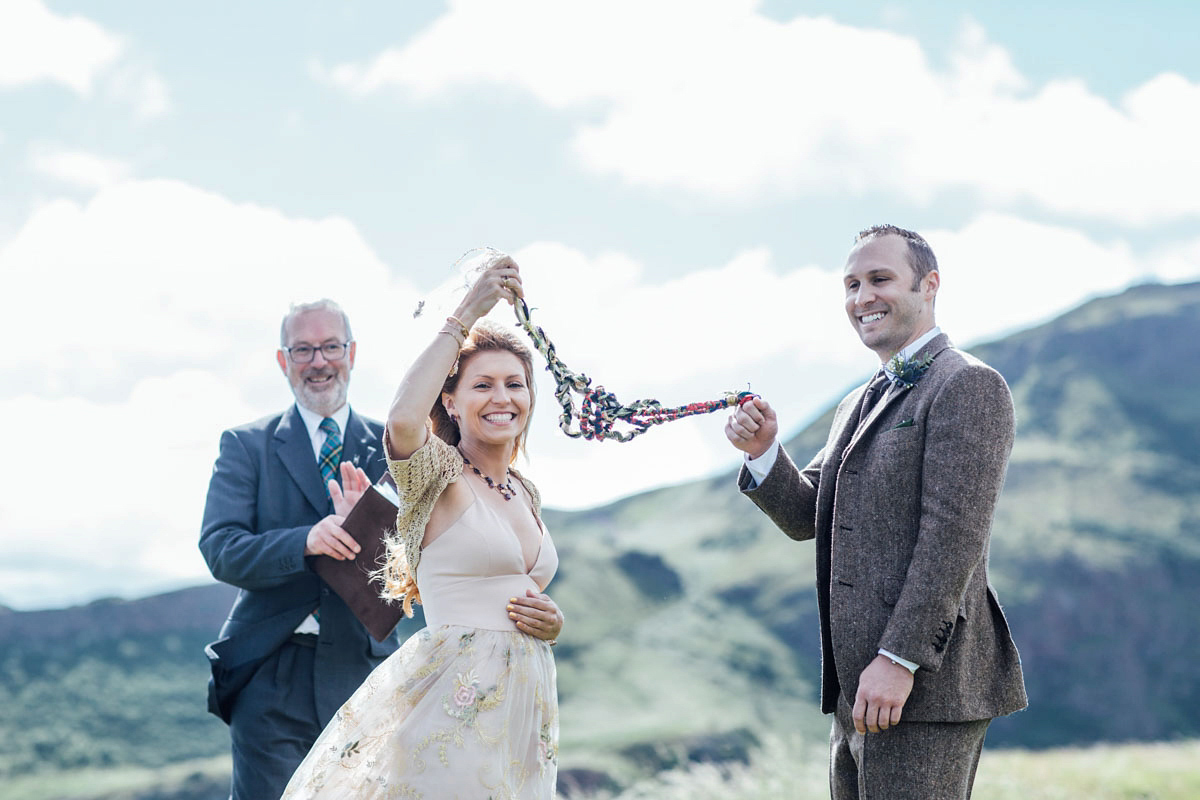 Bride Tatiana wore the Ireland gown by BHLDN for her Scottish elopement. Photography by Carley Buick.