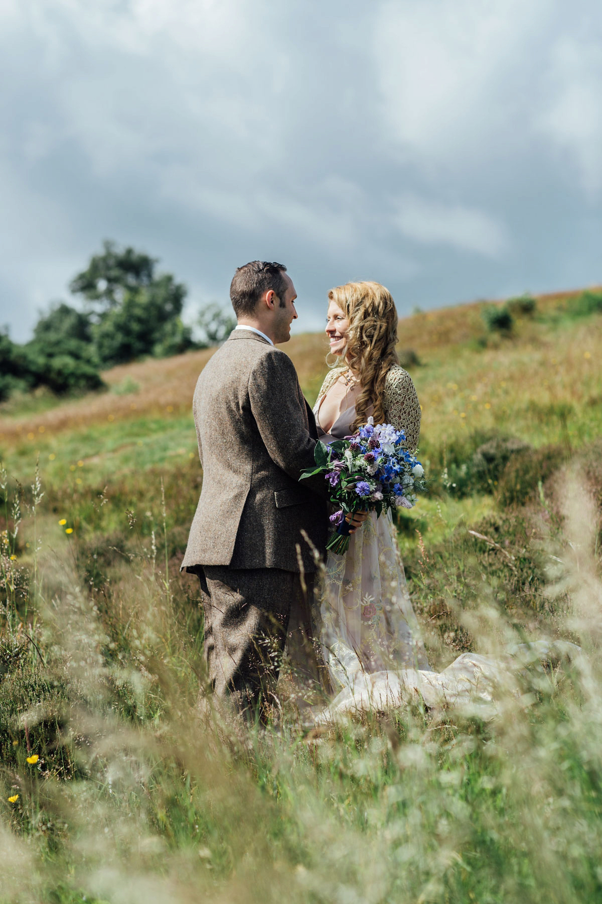 Bride Tatiana wore the Ireland gown by BHLDN for her Scottish elopement. Photography by Carley Buick.