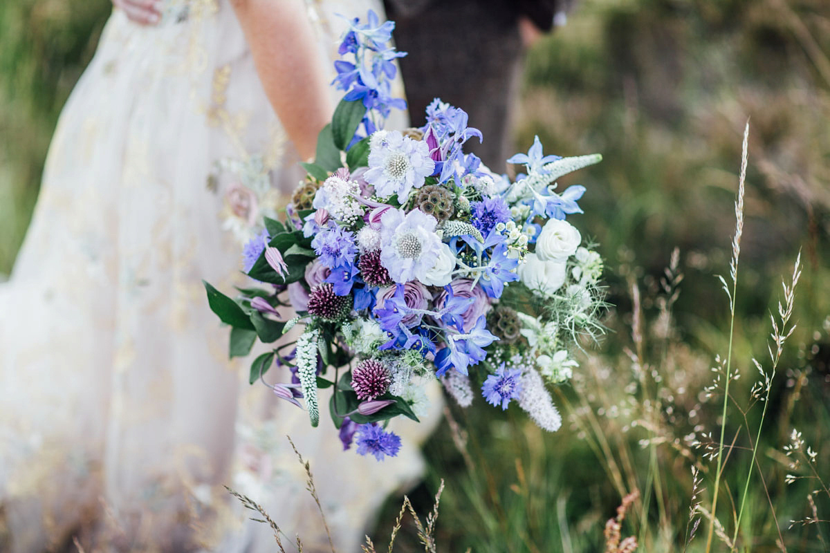 Bride Tatiana wore the Ireland gown by BHLDN for her Scottish elopement. Photography by Carley Buick.