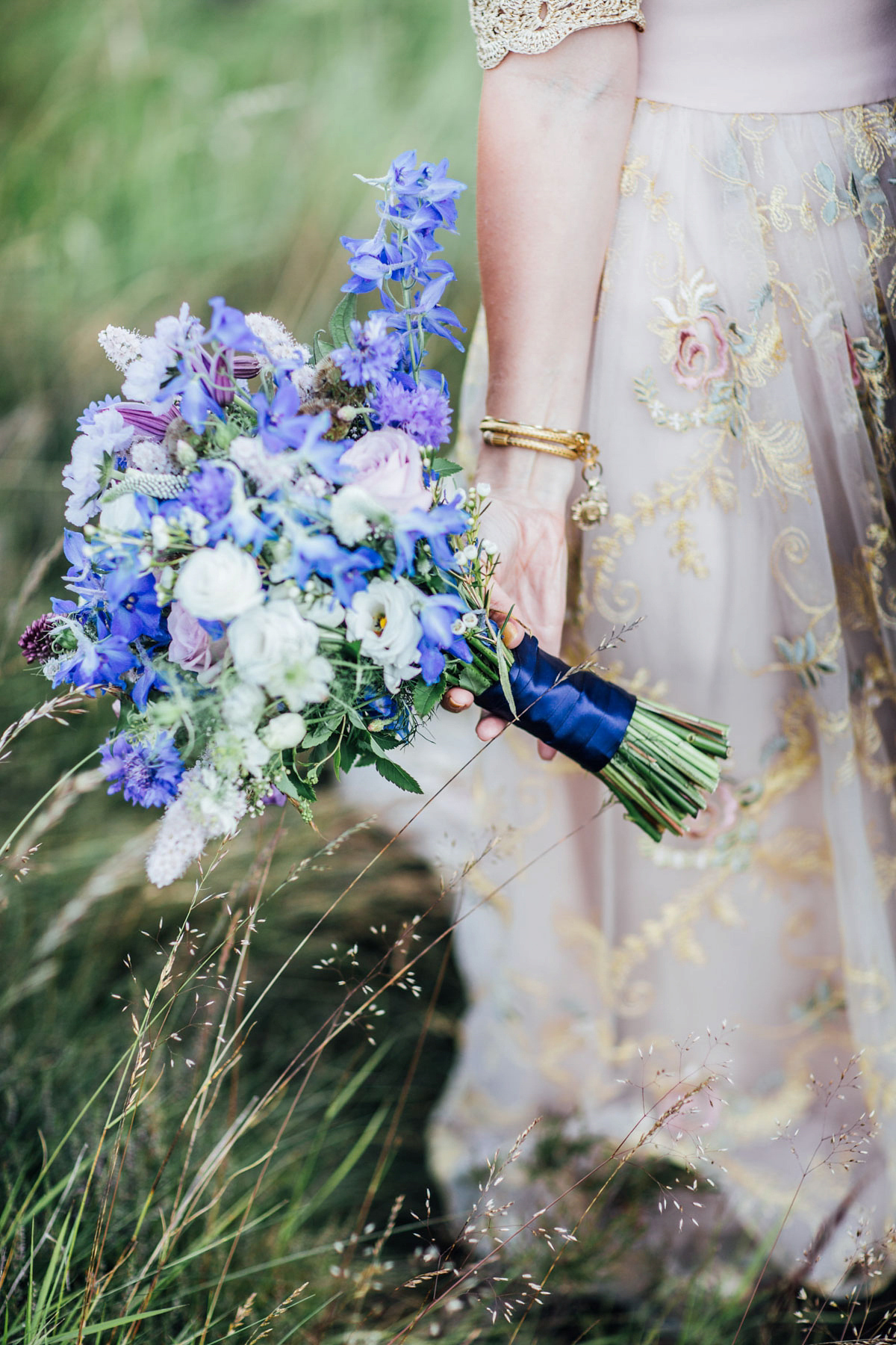 Bride Tatiana wore the Ireland gown by BHLDN for her Scottish elopement. Photography by Carley Buick.