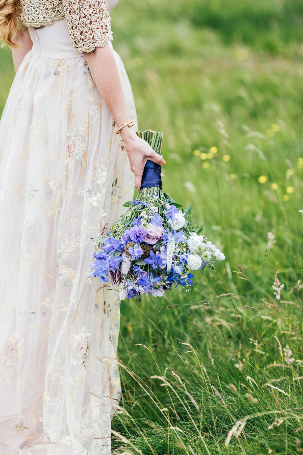 Bride Tatiana wore the Ireland gown by BHLDN for her Scottish elopement. Photography by Carley Buick.