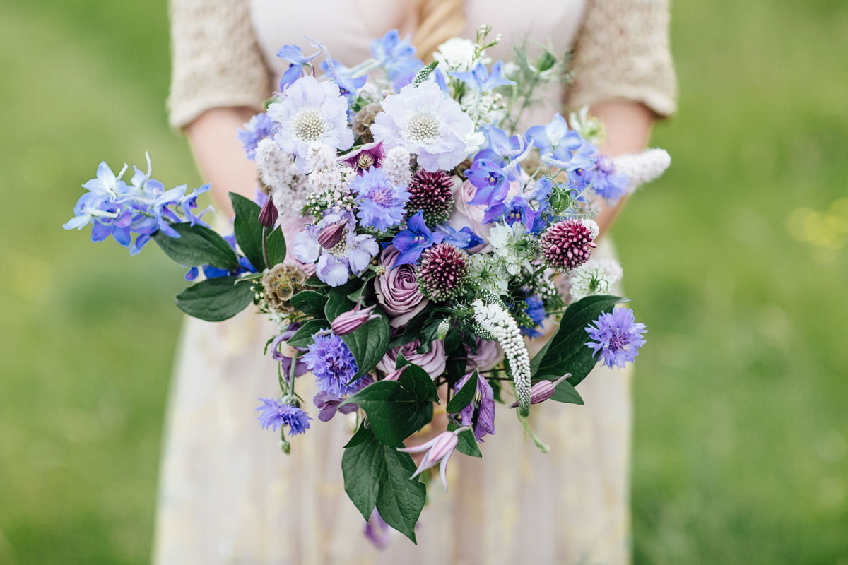 Bride Tatiana wore the Ireland gown by BHLDN for her Scottish elopement. Photography by Carley Buick.