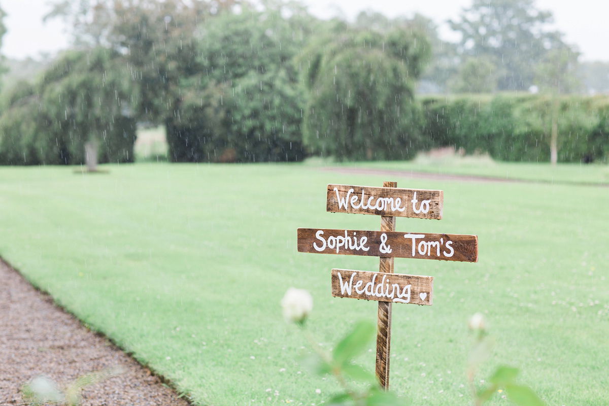 Sophie wore a Sassi Holford gown for her romantic English country garden wedding in pastel shades. Captured by Amy Fanton Photography.