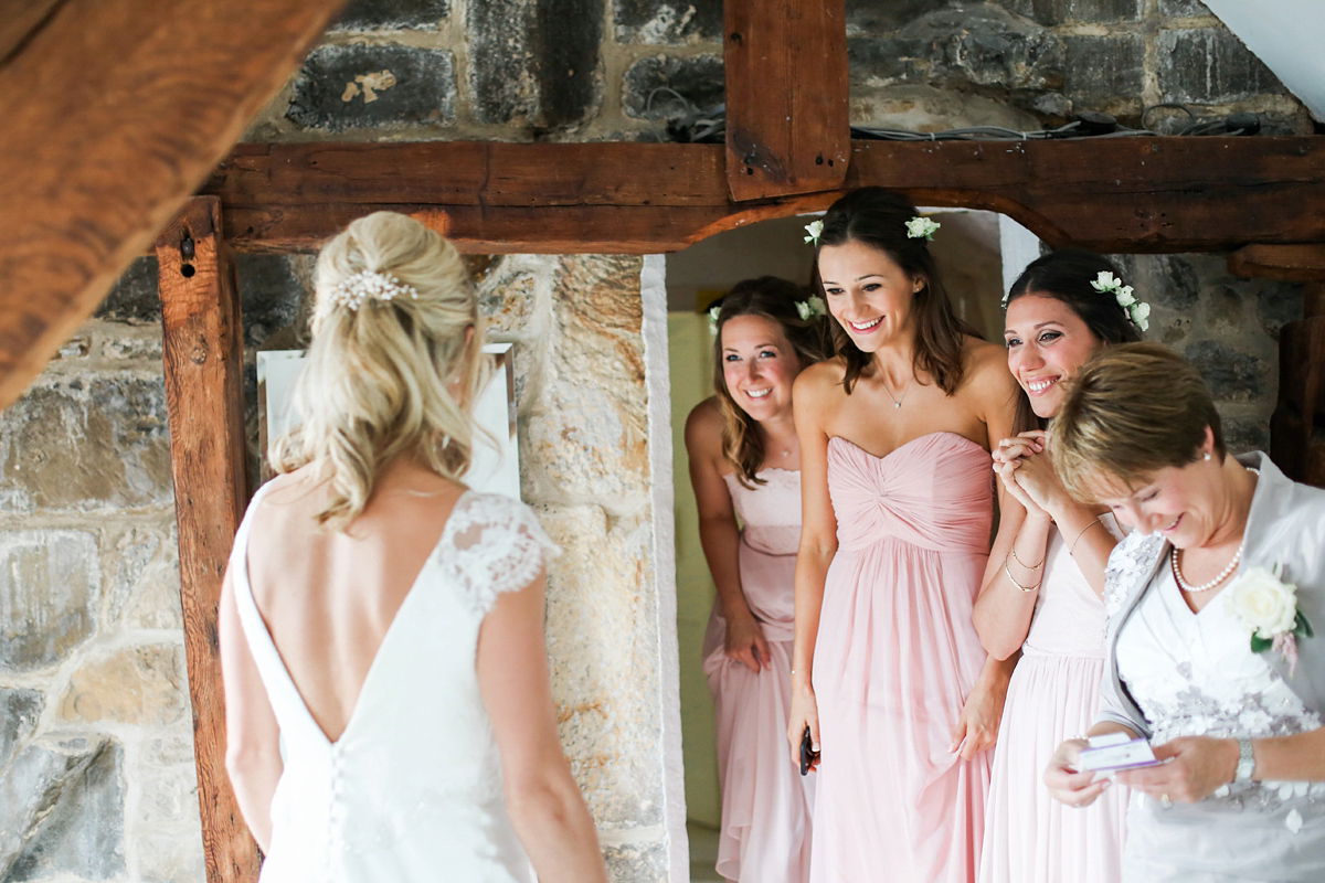 Sophie wore a Sassi Holford gown for her romantic English country garden wedding in pastel shades. Captured by Amy Fanton Photography.