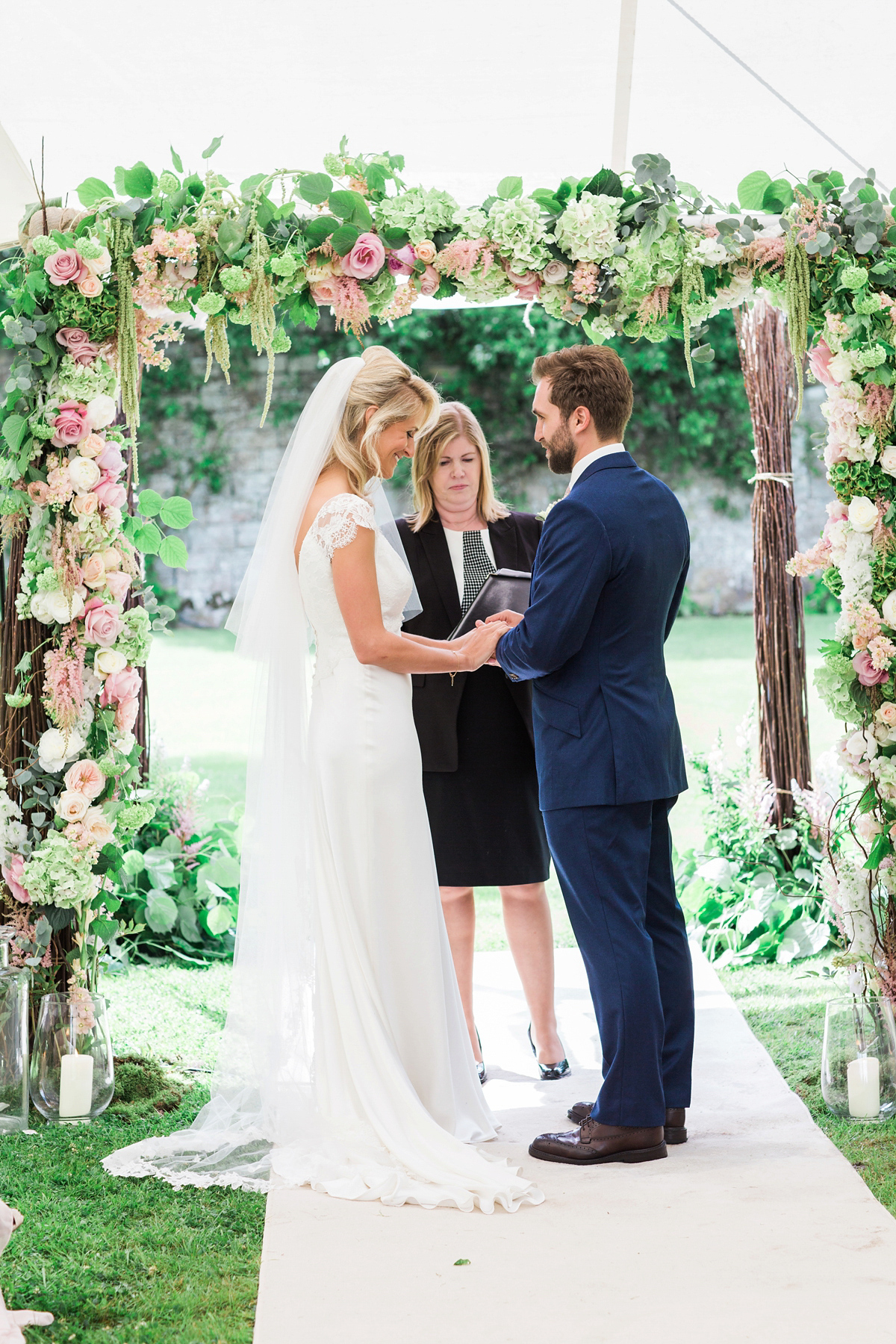 Sophie wore a Sassi Holford gown for her romantic English country garden wedding in pastel shades. Captured by Amy Fanton Photography.