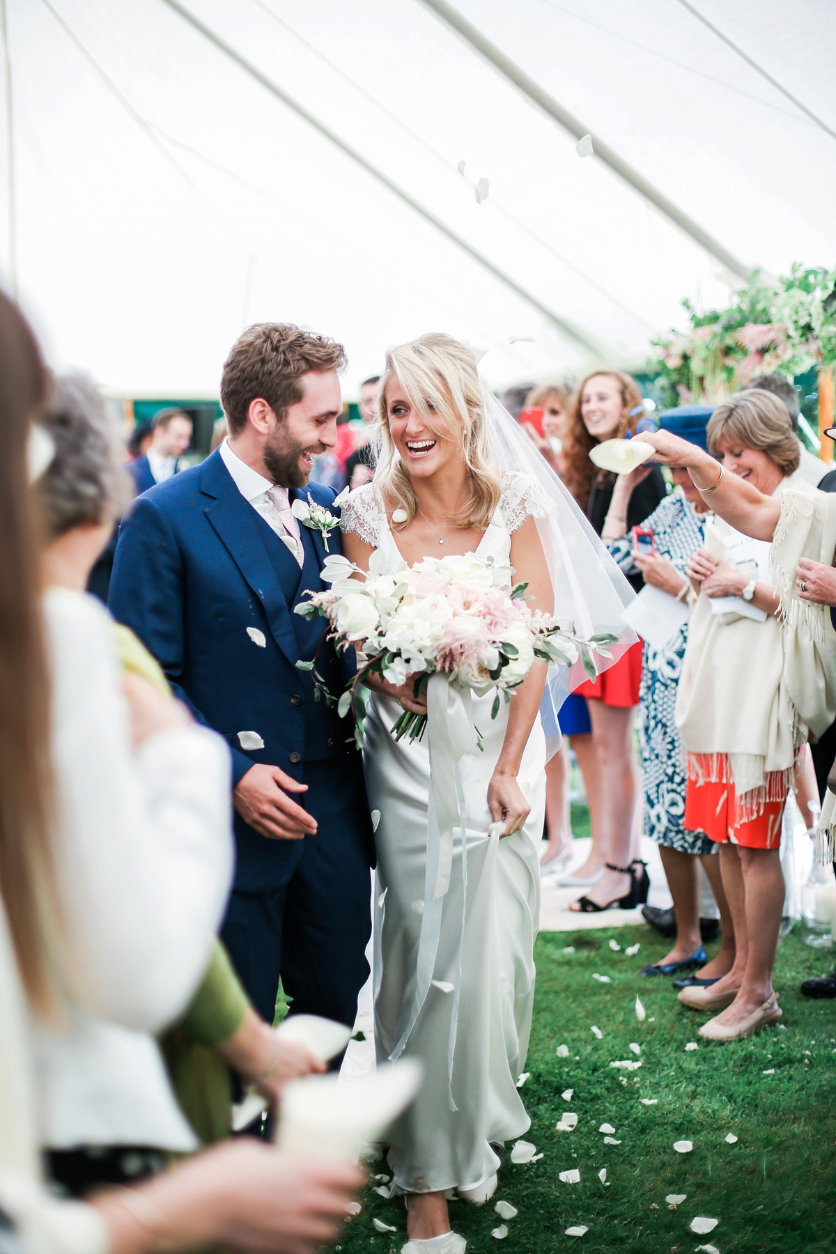 Sophie wore a Sassi Holford gown for her romantic English country garden wedding in pastel shades. Captured by Amy Fanton Photography.