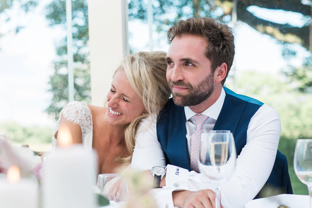 Sophie wore a Sassi Holford gown for her romantic English country garden wedding in pastel shades. Captured by Amy Fanton Photography.