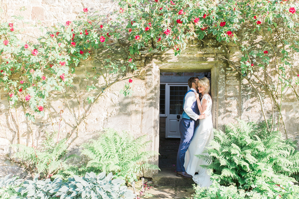 Sophie wore a Sassi Holford gown for her romantic English country garden wedding in pastel shades. Captured by Amy Fanton Photography.