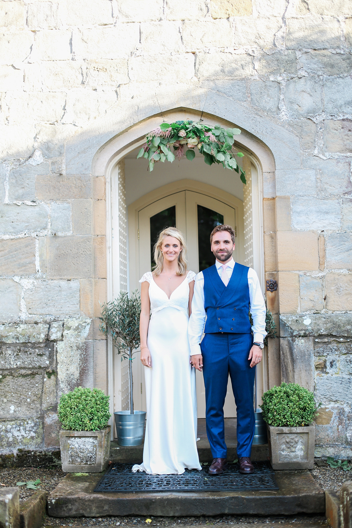 Sophie wore a Sassi Holford gown for her romantic English country garden wedding in pastel shades. Captured by Amy Fanton Photography.