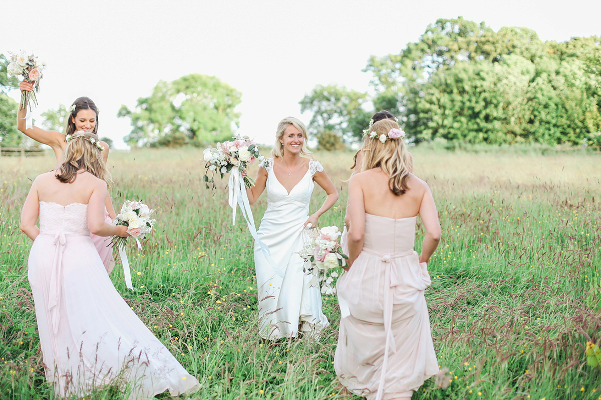 Sophie wore a Sassi Holford gown for her romantic English country garden wedding in pastel shades. Captured by Amy Fanton Photography.