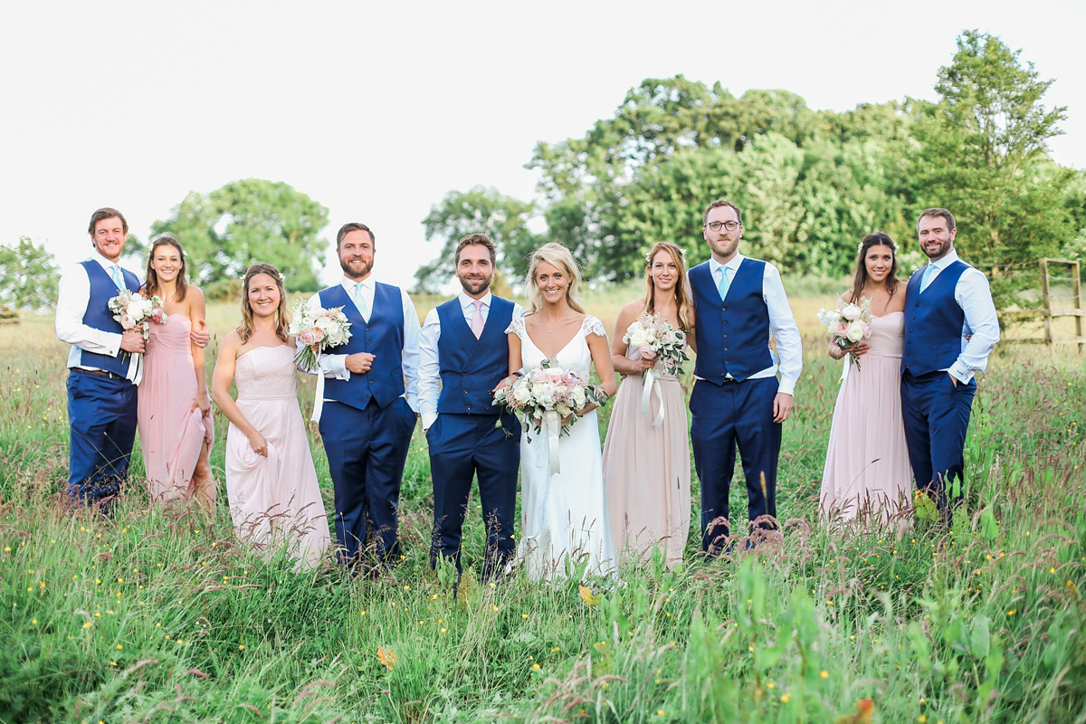 Sophie wore a Sassi Holford gown for her romantic English country garden wedding in pastel shades. Captured by Amy Fanton Photography.