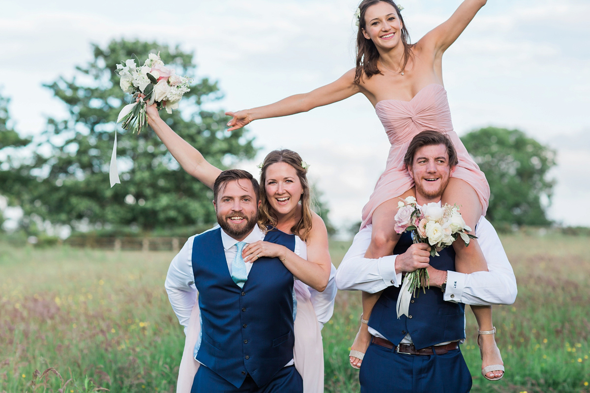 Sophie wore a Sassi Holford gown for her romantic English country garden wedding in pastel shades. Captured by Amy Fanton Photography.