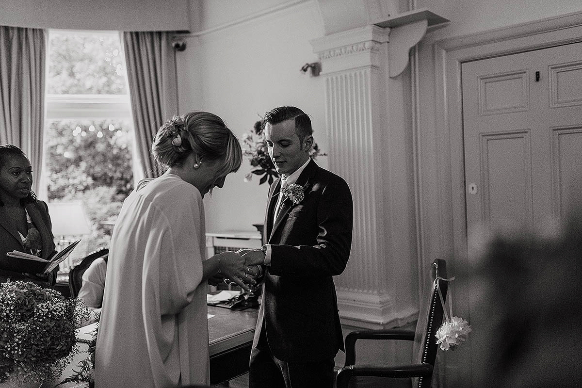 Celine wore a short, chic, pale pink wedding dress for her non-traditional wedding at the Greenwich Yacht Club in London. Captured by Paul Joseph Photography.