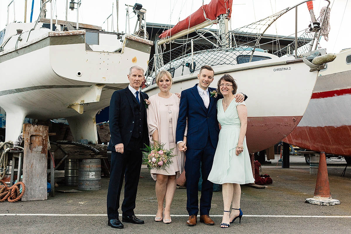Celine wore a short, chic, pale pink wedding dress for her non-traditional wedding at the Greenwich Yacht Club in London. Captured by Paul Joseph Photography.