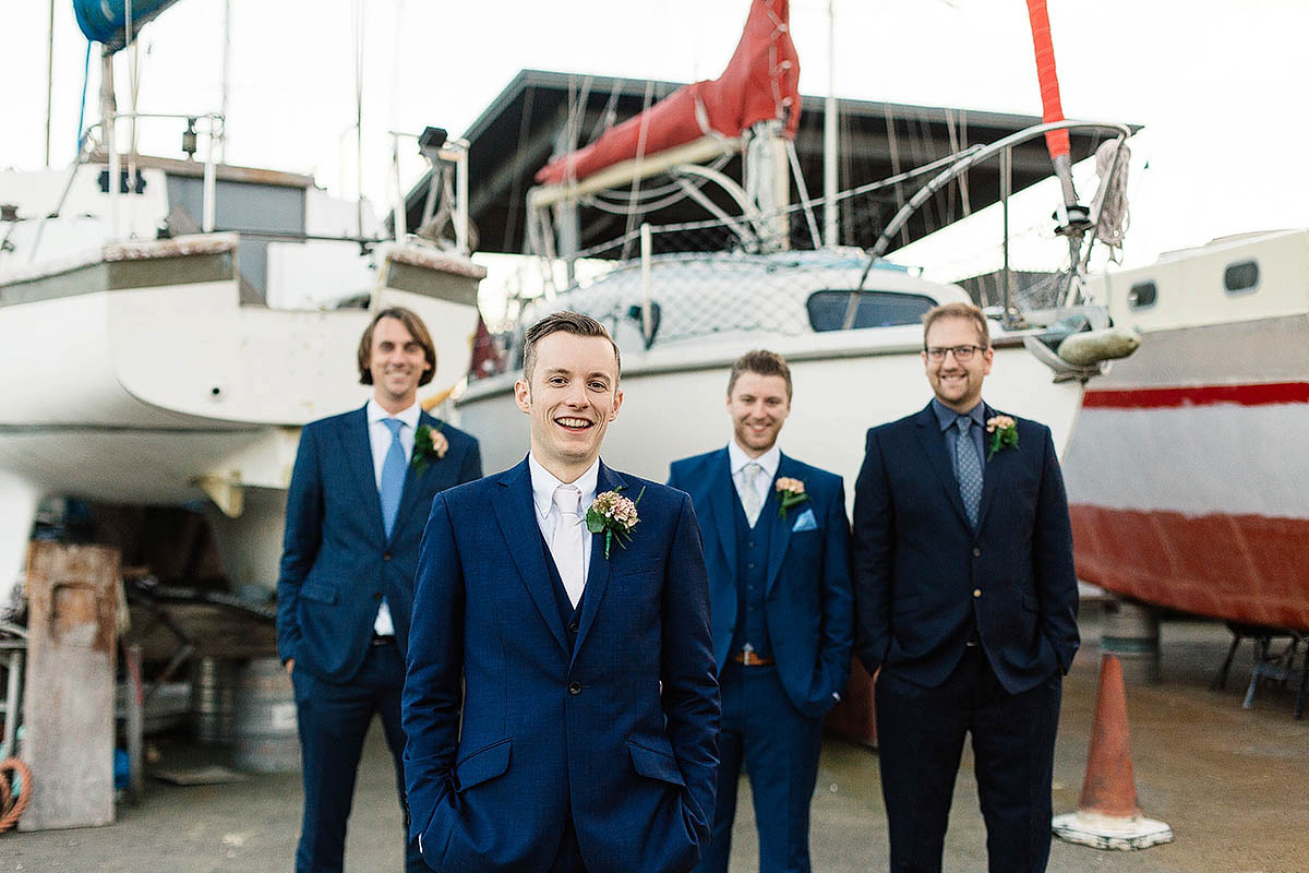 Celine wore a short, chic, pale pink wedding dress for her non-traditional wedding at the Greenwich Yacht Club in London. Captured by Paul Joseph Photography.