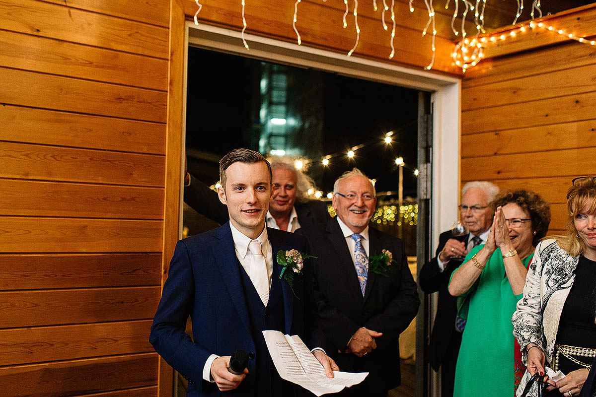 Celine wore a short, chic, pale pink wedding dress for her non-traditional wedding at the Greenwich Yacht Club in London. Captured by Paul Joseph Photography.