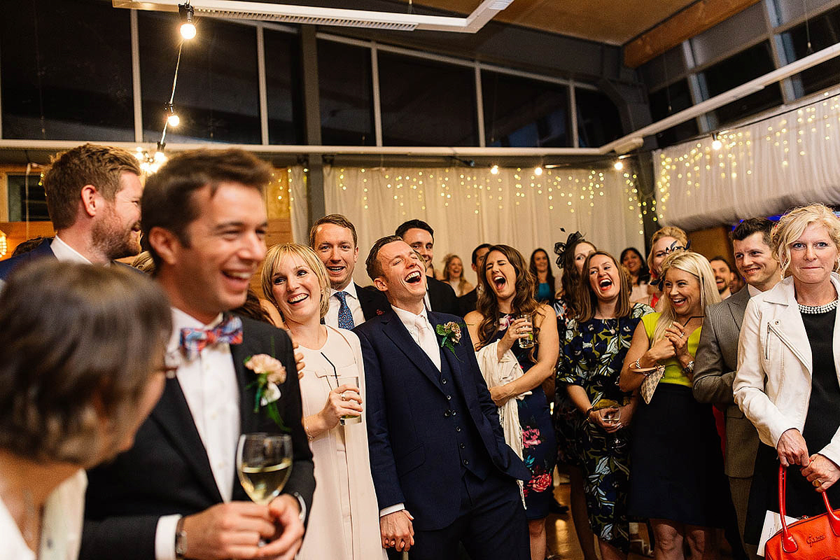 Celine wore a short, chic, pale pink wedding dress for her non-traditional wedding at the Greenwich Yacht Club in London. Captured by Paul Joseph Photography.