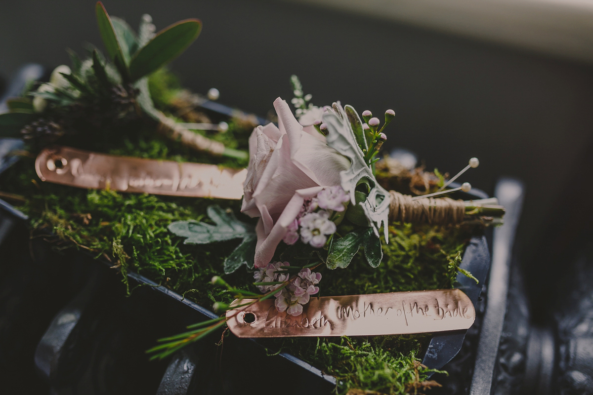 Bride Lucy wore the 'Peony' gown by Naomi Neoh for her romantic and elegant gin inspired wedding in the Lake District. Photography by Lottie Elizabeth.