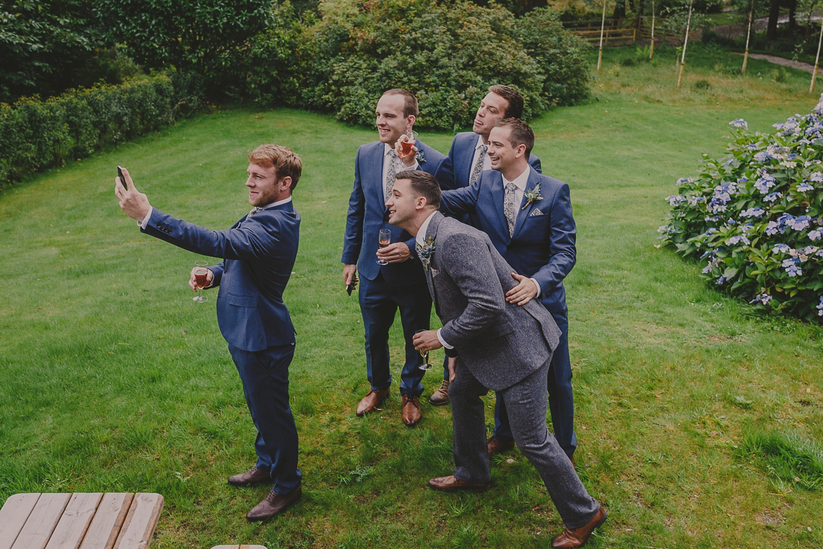 Bride Lucy wore the 'Peony' gown by Naomi Neoh for her romantic and elegant gin inspired wedding in the Lake District. Photography by Lottie Elizabeth.